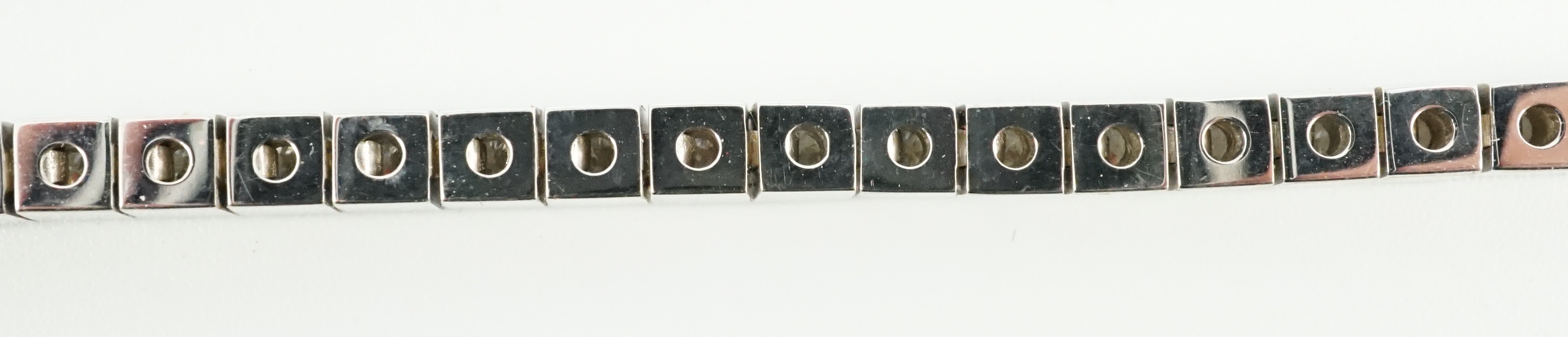 A late 20th century Cartier 18ct white gold and diamond set line bracelet